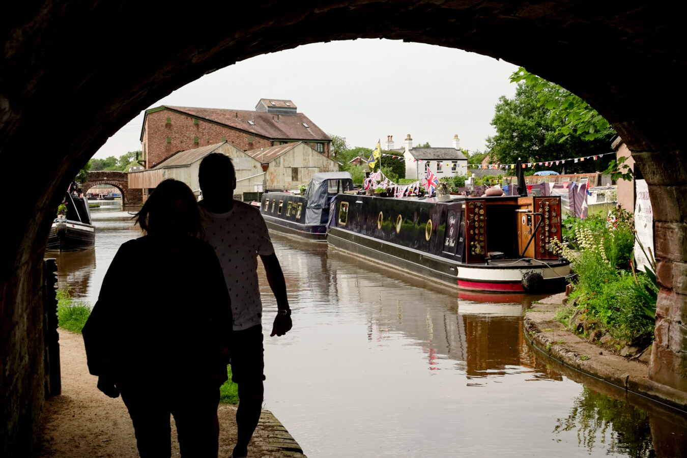 People walking under Market Drayton Canal Bridge | Visit Shropshire